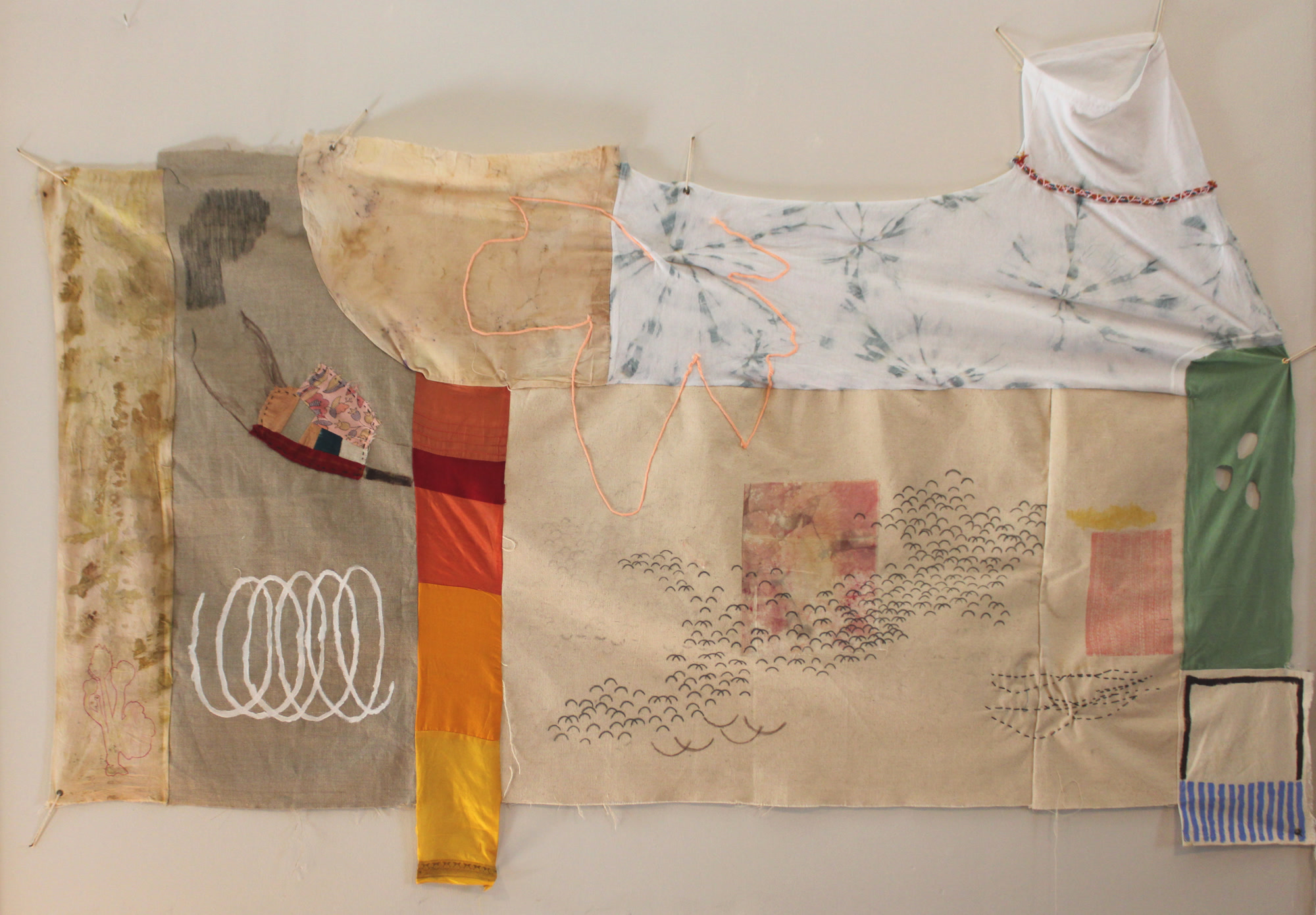 Large fabric painting, Another Way of Response, showing horizontal landscape bands in muted olive, terracotta, and indigo with graphite markings and visible seam stitching.