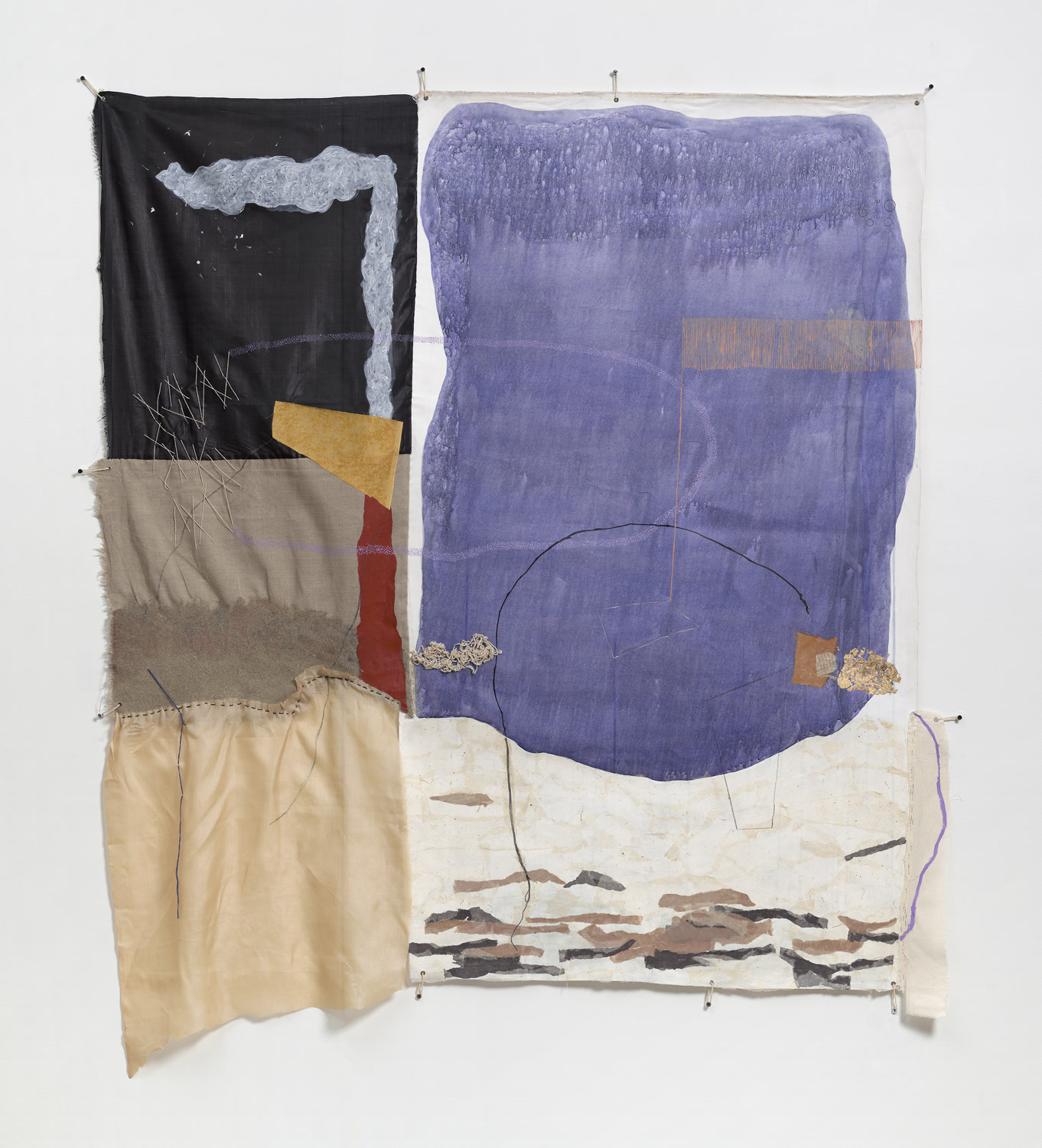 Textured mixed-media fabric work, Two Sides of It, featuring layered paper collages, sandy mineral textures, and running stitches across a warm earth-toned canvas.