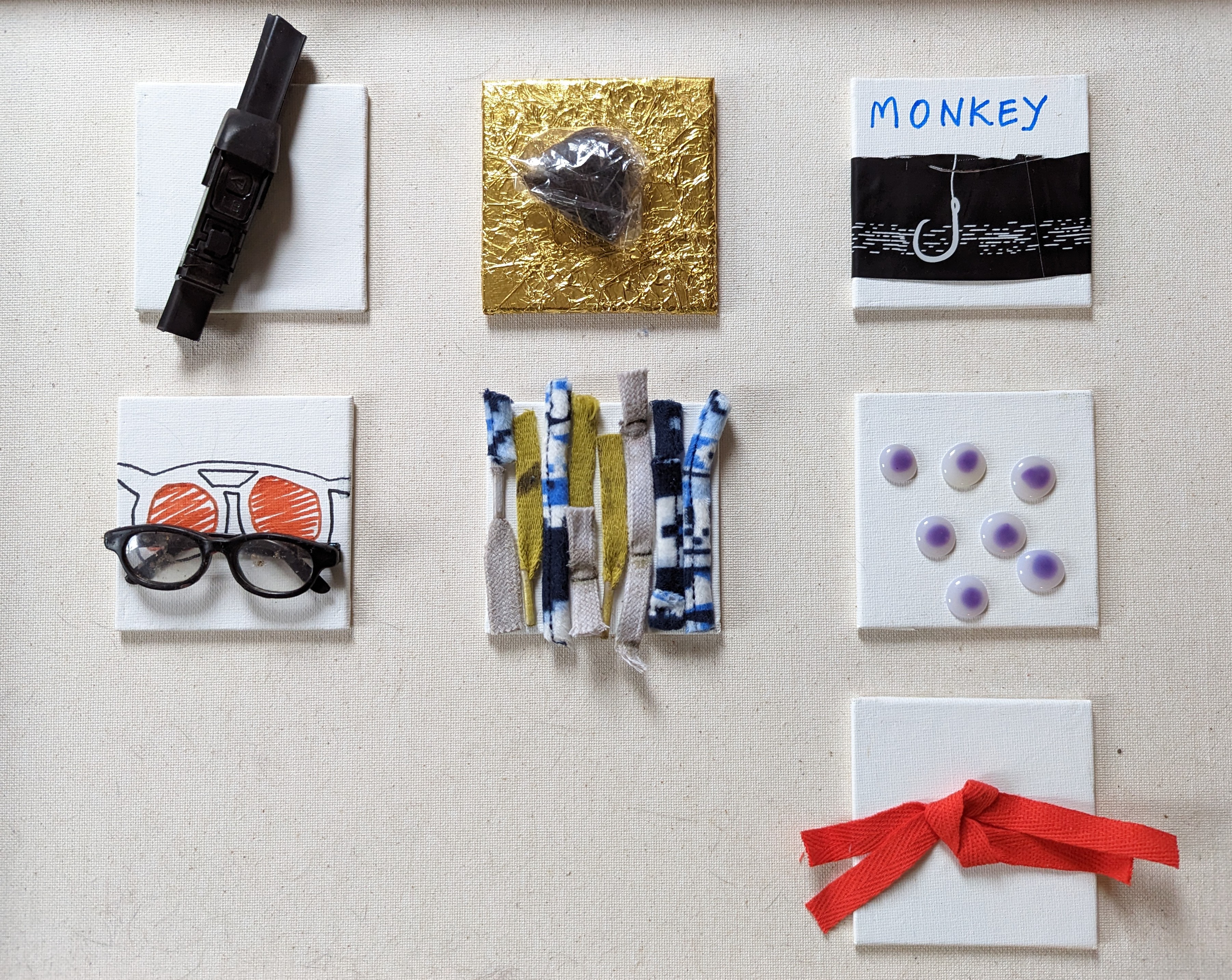 Grid of 7 assemblages on linen: white canvas with dried magenta composite flowers, embroidered '21H' letters, mauve wash inscribed 'SPILL', halved dried pomelo, scorched cloth scrap with charred edges, column of graphite powder with silver strip, and graphite smear study marked '2ND ATTEMPT'.
